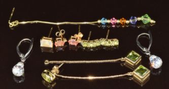 A pair of 14k white gold earrings each set with a crystal bead (3.6g), pair of 9k gold earrings