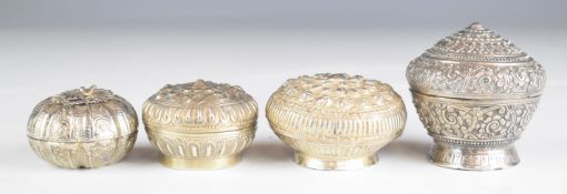 Four Chinese, Burmese or similar silver trinket pots, one having Chinese or similar character