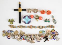 A silver charm bracelet with over thirty eight enamel charms mostly silver 800 or sterling silver (