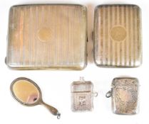 Two curved hallmarked silver cigarette cases, hallmarked silver vesta case, miniature hallmarked