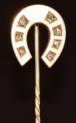Victorian stick pin set in the form of a horseshoe set with seven rose cut diamonds, 5.2g