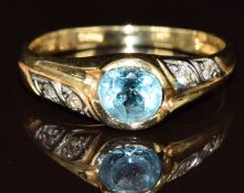 An 18ct gold ring set with an oval cut topaz and diamonds, 2.8g, size Q