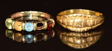 A yellow metal ring and a 9ct gold ring set with peridot, citrine, topaz and garnet (one stone