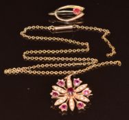 Edwardian yellow metal pendant/ brooch set with seed pearls and rubies, each ruby approximately 0.