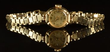 Rotary 9ct gold ladies wristwatch with gold hands and hour markers, champagne dial and mechanical