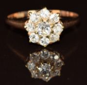 A 14k gold ring set with old cut diamonds in a cluster, 1.5g, size J