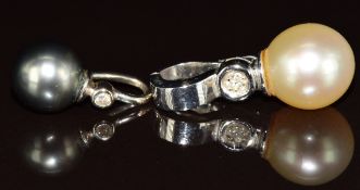 A 14k white gold pendant set with a pearl and diamonds (4.7g) and an 18k white gold pendant set with