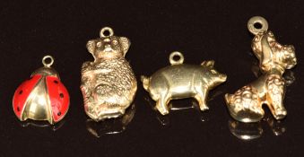 Four 9ct gold charms / pendants in the form of a poodle, koala bear, pig and ladybird, 3.8g
