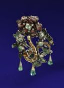 An early 19thC silver gilt pendant/ brooch set with foiled emeralds, citrines and rose cut paste,