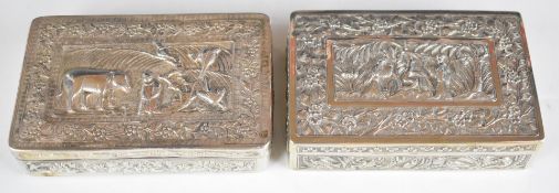 Two Burmese, Indian or similar silver cigarette boxes, both with embossed scenes to lids, one with
