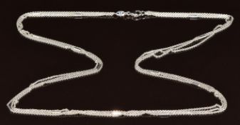 An 18k white gold necklace made up of three strands and cylindrical links, 9g, 50cm