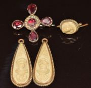 A pair of lava cameo earrings (3.5cm) and a Victorian brooch set with foiled garnets and seed pearls