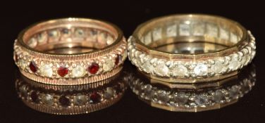 Two 9ct gold eternity rings set with synthetic stones, 7.5g, size P & K