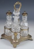 William IV hallmarked silver four bottle cruet stand with gadrooned edge and foliate handle,
