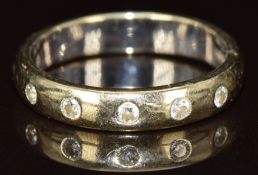 An 18ct gold ring set with five diamonds, 5.1g, size O