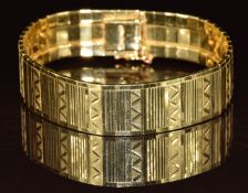 A 14k gold bracelet made up of rectangular links with cut out decoration, 42.4g, 19cm