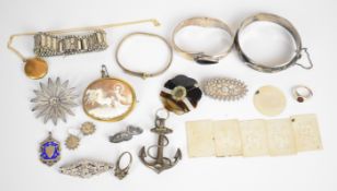 A collection of silver jewellery including three bangles, Victorian bracelet made up of engraved