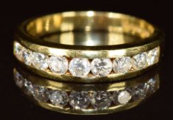 An 18ct gold ring set with nine round cut diamonds, the largest approximately 0.1ct, 5.2g, size Q