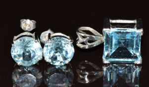 A pair of 9ct white gold earrings and a 9ct white gold pendant, both set with a topaz, 9.5g