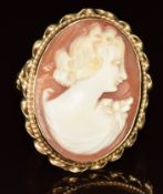 A 9ct gold ring set with a cameo depicting a young woman, 5.2g, size L