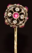 Victorian stick pin set with ruby cabochons and old and rose cut diamonds in a pierced sphere