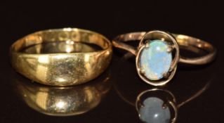 An 18ct gold ring (2.7g, Birmingham 1888) and a 9ct gold ring set with an opal triplet (1.5g)