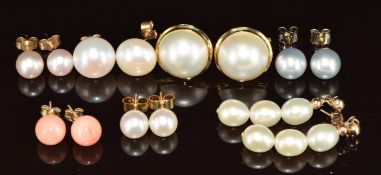 A pair of 14k gold earrings set with Mabe pearls, two pairs of 18k gold earrings set with cultured