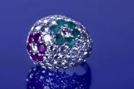 An 18k white gold ring set with round cut diamonds, six rubies each approximately 0.15ct and six