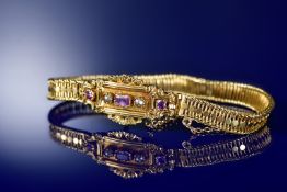 French yellow metal bracelet set with foiled pink sapphires and pearls, with left facing ram's