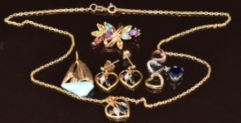 A 9k white gold pendant set with a sapphire (0.6g), 14k gold pendant set with Larimar (1.6g), 9k