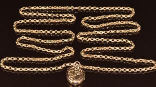 A 9ct gold guard chain made up of oval links (19.9g, 108cm) and an Edwardian locket with engraved