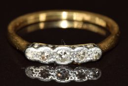 An 18ct gold ring set with five diamonds in a platinum setting, 2.4g, size O