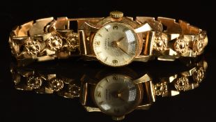 Classic 18ct gold ladies wristwatch with gold hands, Arabic numerals and hour markers, silver dial