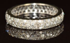 An 18ct white gold c1920 eternity ring set with diamonds, 3.3g, size O