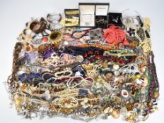 A collection of jewellery including beads, bracelets, vintage earrings, brooches including