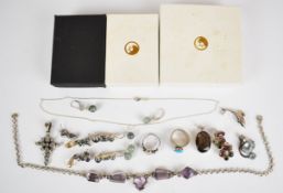 A silver necklace, four silver pendants, two silver rings and four pairs of earrings