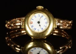 Unnamed 18ct gold ladies wristwatch with blued hands, blue Arabic numerals, white enamel dial and