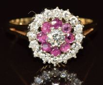 A 9ct gold ring set with diamonds and rubies in a cluster, largest diamond 0.2ct, 3.4g, size T