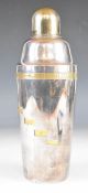Asprey silver plated and gilt cocktail shaker with turning body showing ingredients for different