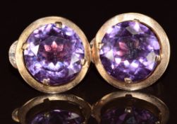 A pair of 12k gold Egyptian earrings each set with a round cut synthetic colour change sapphire, 7.