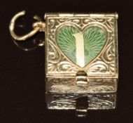 A 9ct gold charm / pendant set with a £1 note, 8.6g