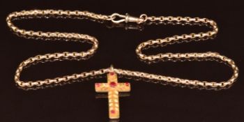 A c1900 9ct rose gold chain (48cm) and a 9ct gold cross set with garnets and applied foliate