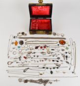 A collection of silver jewellery including thirteen rings, brooches including pressed amber,