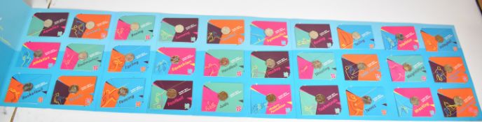 Royal Mint London 2012 Olympics collector's album of twenty nine 50 pence coins and completer