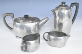 Tudric Pewter four piece tea set of Arts and Crafts hammered design, each marked 01536 to underside,