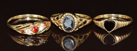 Three 9ct gold rings comprising hematite, onyx and garnet and cubic zirconia, 4g, size Q, L & N