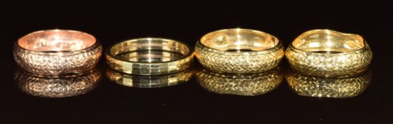 Four 9ct gold rings, three with hammered decoration and the other with faceted decoration, 3.1g,