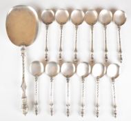 Continental silver cutlery set comprising twelve spoons and larger serving scoop or spoon, each with