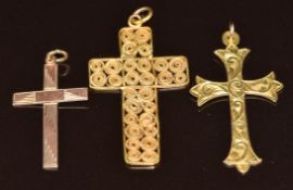 Two 9ct gold cross pendants (2.8g, 3.8 & 3cm) and a yellow metal African gold filigree cross pendant