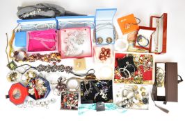 A collection of costume jewellery including garnet necklace and bracelet, silver and shell